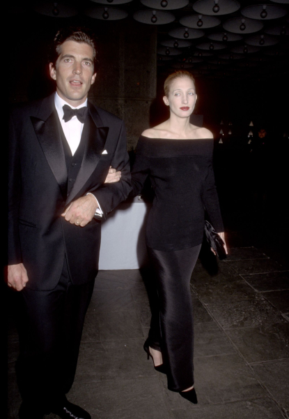 John F. Kennedy Jr. in a tuxedo and Carolyn BessetteKennedy in an offtheshoulder black gown